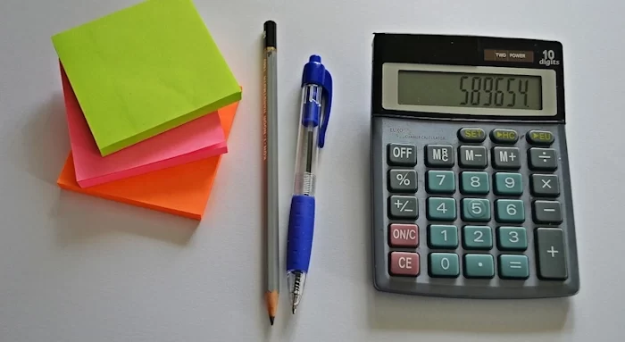 A photo of a TPD payout calculator on a desk showing the result of a TPD payment calculation